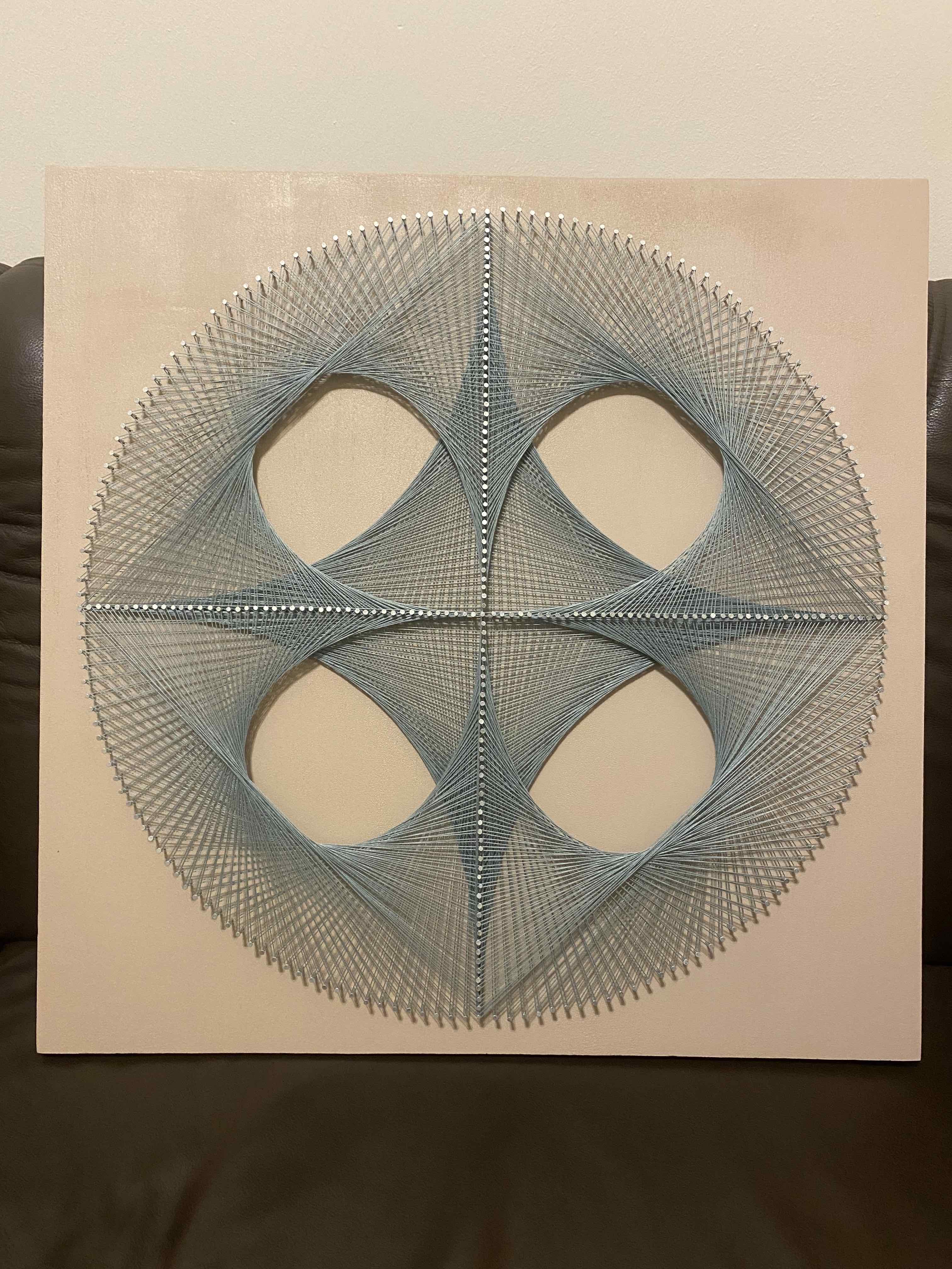 picture of my second final string art piece with a clover pattern